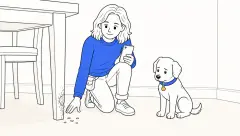 How to stop a dog from chewing furniture: a trainer examines deep tooth marks while a sad puppy sits nearby.