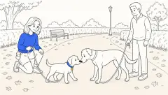 ClickerPup gently sniffs a calm adult dog on a quiet park path while both handlers hold loose leashes.